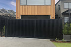 Vertical louvre sliding gate in black installed - XGATE NZ