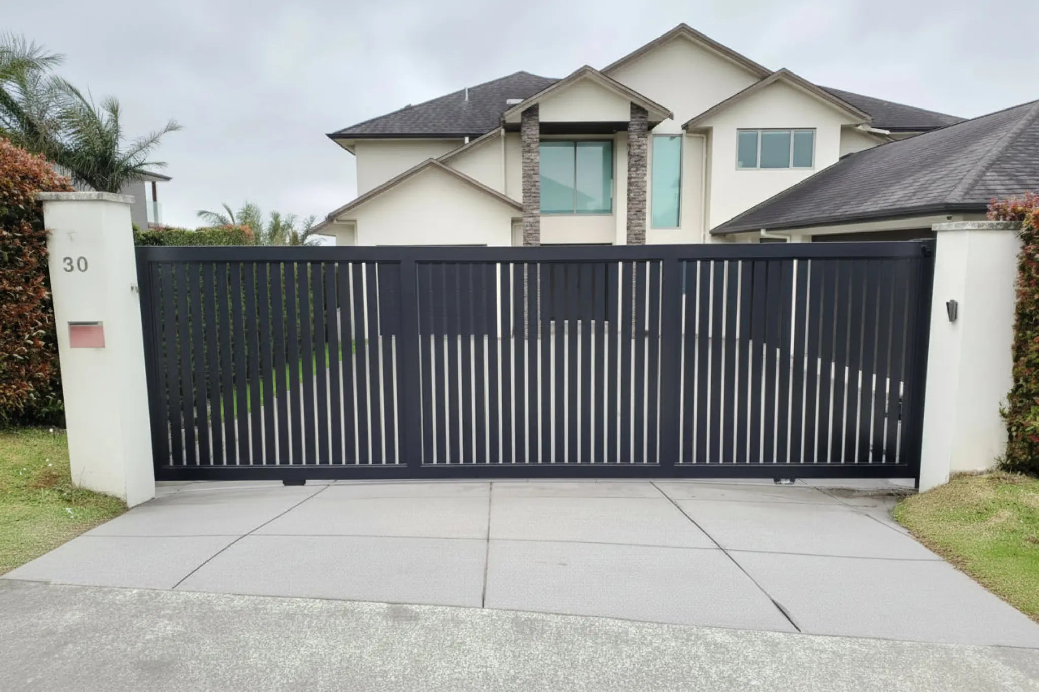 Vertical Slat Sliding Gate in Black 5015mm Installed - XGATE NZ