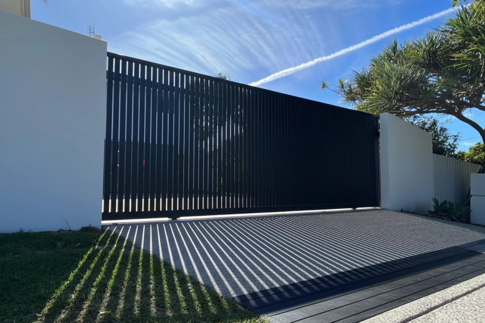 Vertical Slat Sliding Gate in Black 5915mm Installed - XGATE NZ
